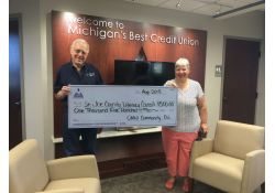 Omni Credit Union gives a Grant to the Literacy Council